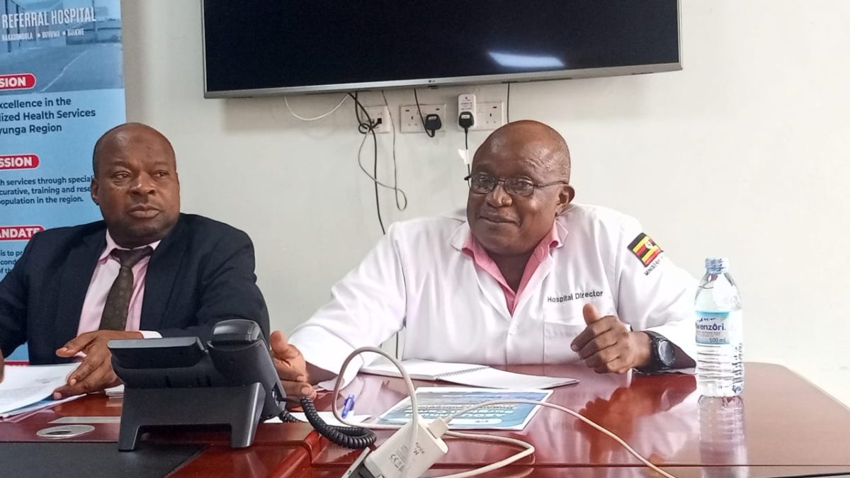 Salim Kiveijinja (L) and Dr. Robert Ssentongo (R) during a press briefing in Kayunga
