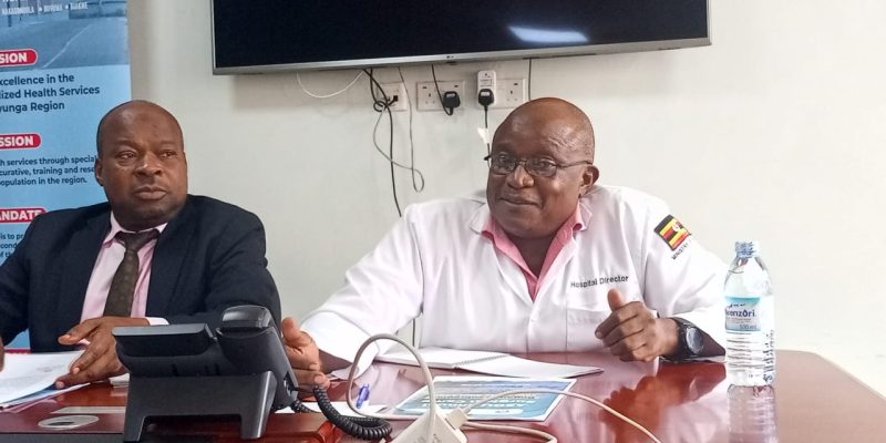 Salim Kiveijinja (L) and Dr. Robert Ssentongo (R) during a press briefing in Kayunga